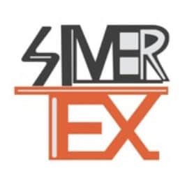 A modern IT solutions office with technology staff working on computers.