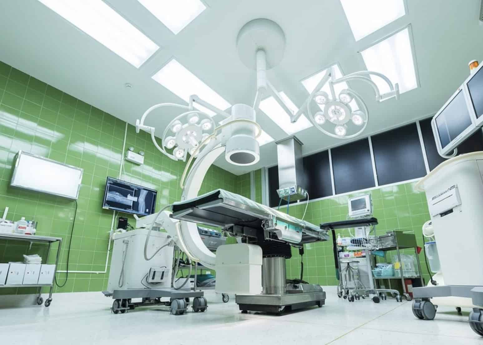 High-tech operating room with advanced medical equipment and surgical lighting, ready for complex surgeries.