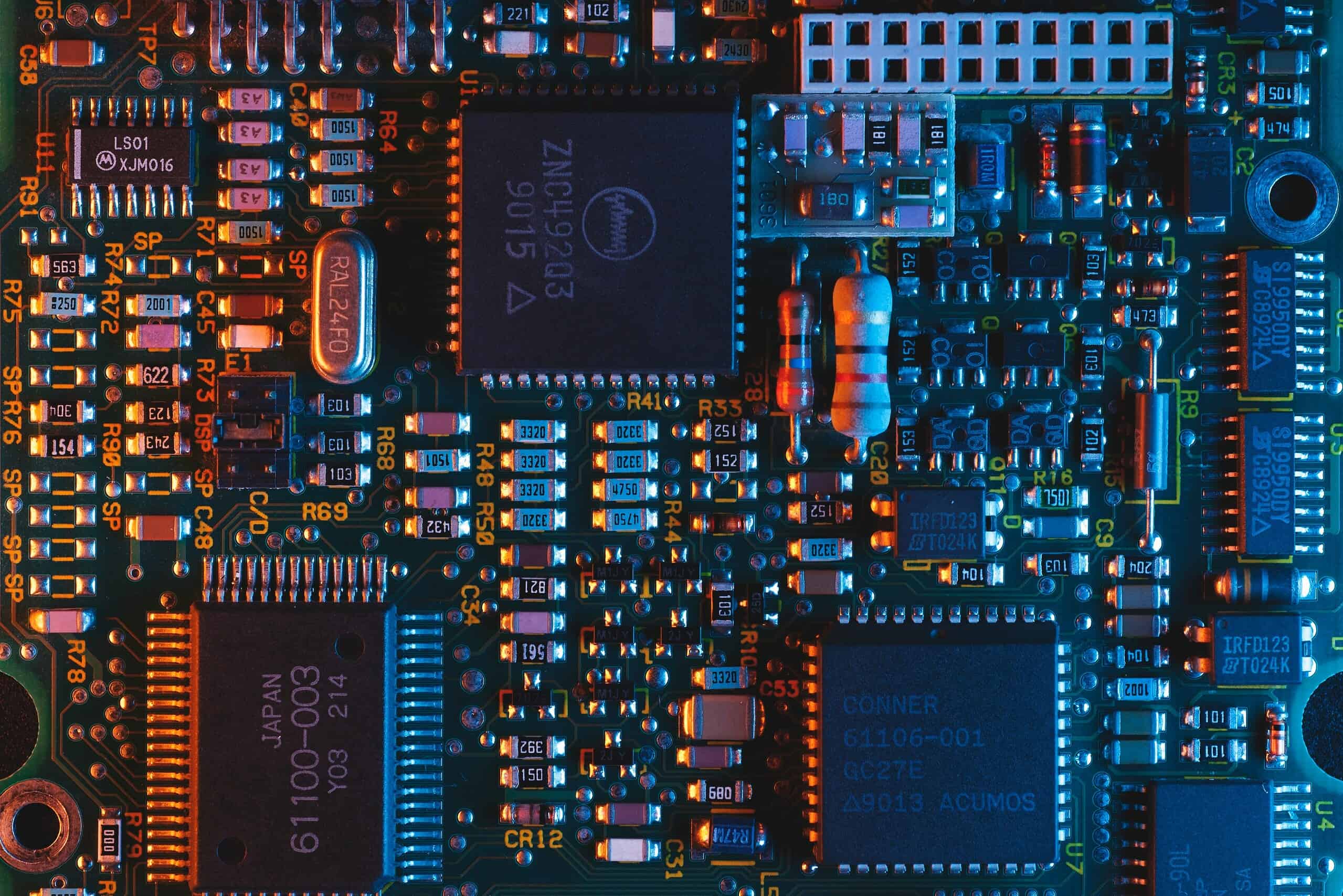 umberto-jXd2FSvcRr8-unsplash Advanced electronic circuit board with integrated chips and compact components for tech innovation.